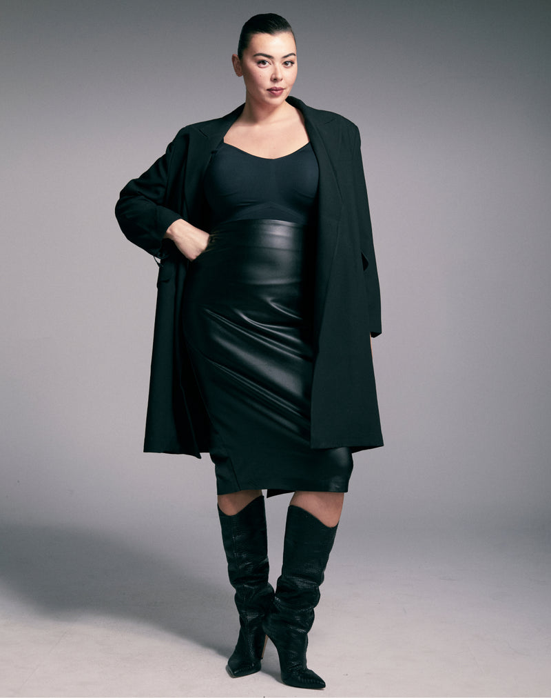 plus size woman in workwear outfit